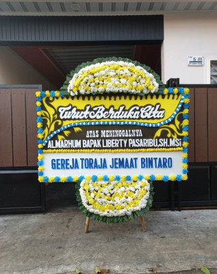 Papan Bunga Duka di Belo